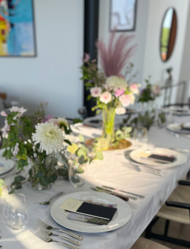 Dining room set elegantly with flowers