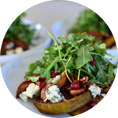 Roasted spiced acorn squash mesclun greens, gorgonzola, pomegranate seeds