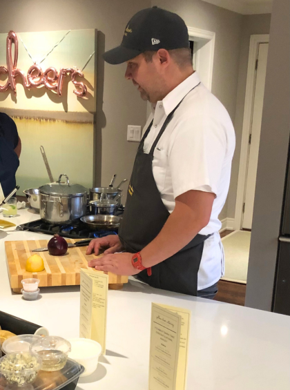 Chef Bill standing behind a cutting board
